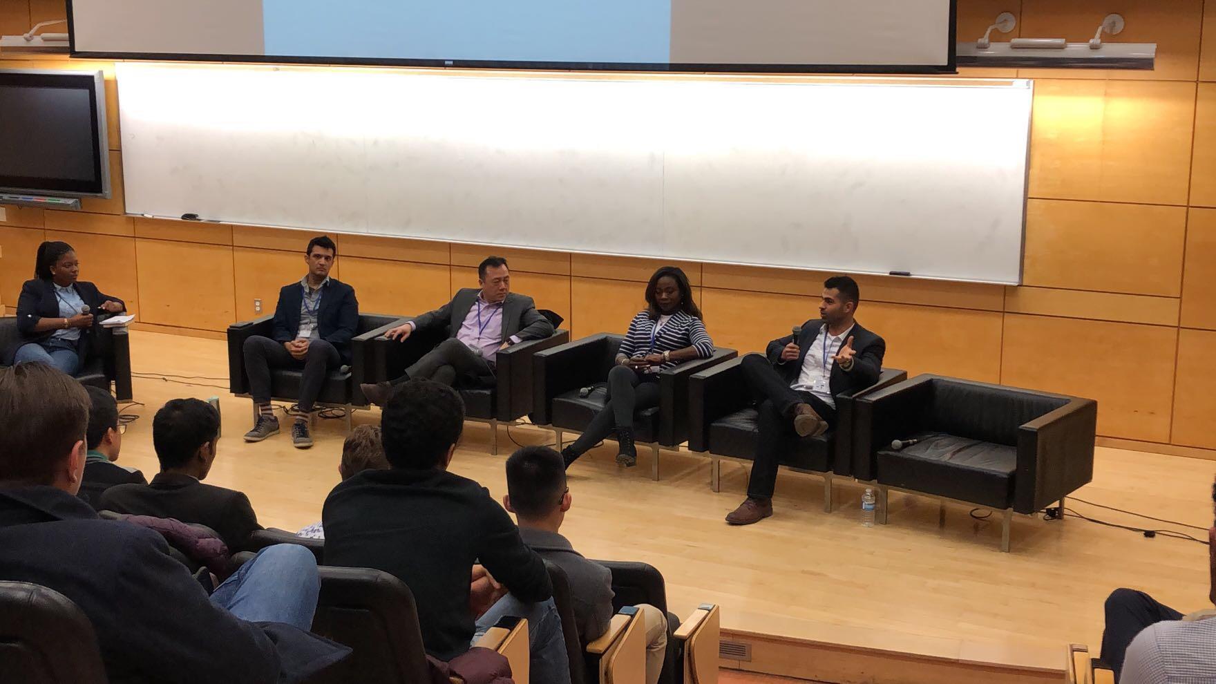 Peyman Moeini speaking on a panel about artificial intelligence at an IEEE event