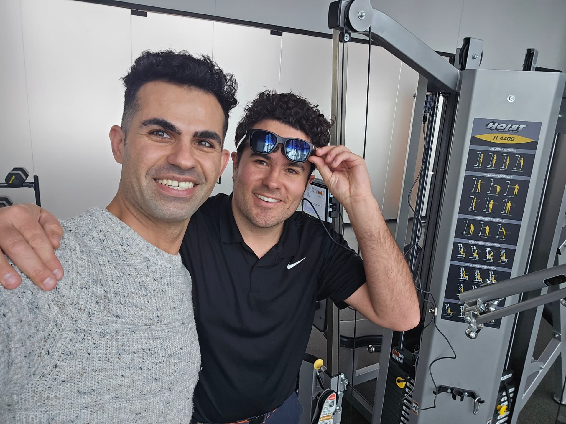 Peyman Moeini and a StrengthPro collaborator beside strength-training equipment