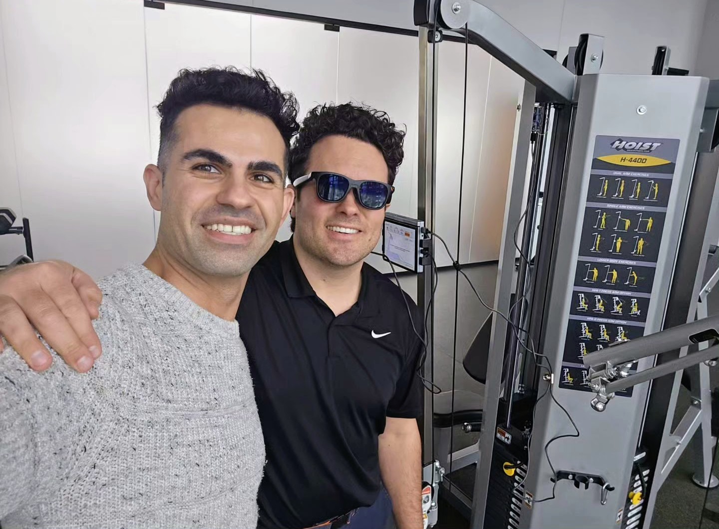 Peyman Moeini and a StrengthPro collaborator beside strength-training equipment
